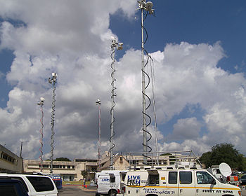 English: News vans at the Texas Department of ...
